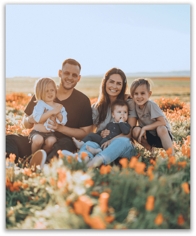 happy family surrounded by flowers